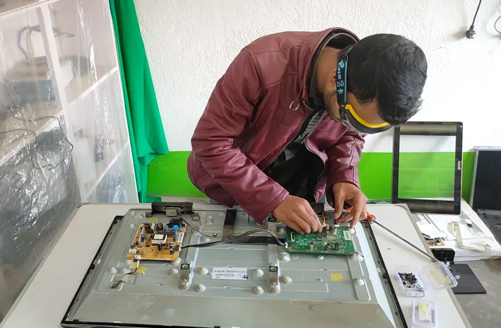 Technician diagnosing VU LED TV display issue